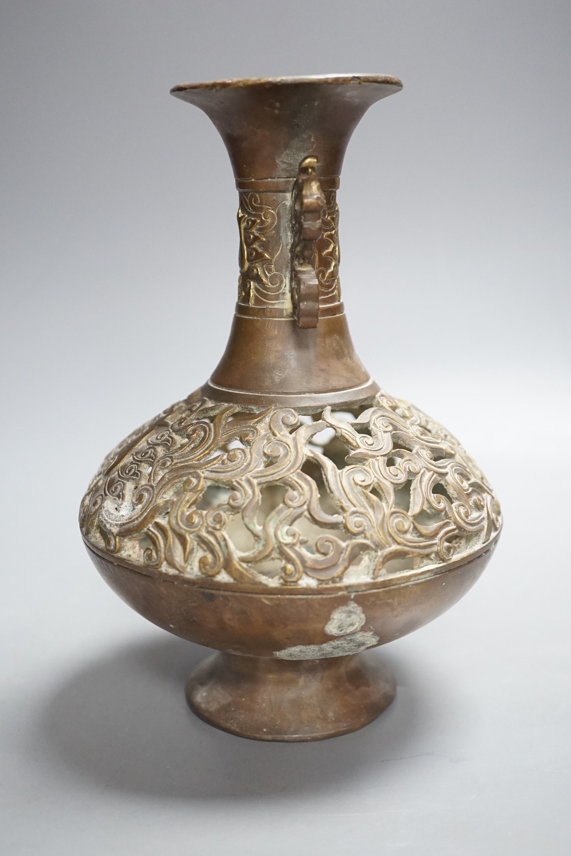 A Chinese pierced brass vase - 20cm tall
